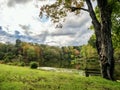 Tomlinson Run State Park in West Virginia in the fall with the autumn foliage trees in the background and a cloud filled sky and a Royalty Free Stock Photo