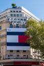 Tommy Hilfiger advertising billboard on the facade of the Galeries Lafayette, Paris, France Royalty Free Stock Photo