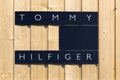 Tommy Hilfiger logo on a wall Royalty Free Stock Photo