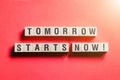 Tomorrow starts now word concept on cubes Royalty Free Stock Photo