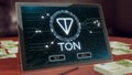 Ton cryptocurrency logo on the pc tablet display. Neon bright blockchain symbol.