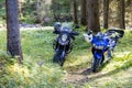 Two motorbikes parked in the Natural Park of Paneveggio Pale di San Martino in Tonadico, Royalty Free Stock Photo