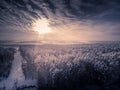 Toned. Aerial view on winter forest and frozen river. Deforestation for power lines Royalty Free Stock Photo