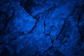 Toned cracked rock texture. Black dark blue stone background. Grunge. Navy blue rough surface. Royalty Free Stock Photo