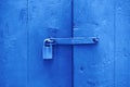 Toned image. Closeup wooden door with lock, old town. Color of the year. Beautiful blue background for design Royalty Free Stock Photo