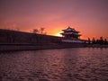 Toned image of the fortress with a tower Forbidden City in Beijing on the background of sunset at clear sky Royalty Free Stock Photo