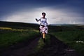 Toned image of young woman running on a countryside road Royalty Free Stock Photo