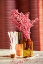 Toned makeup desk with bottles, lipstick and cotton buds in the fashion store Royalty Free Stock Photo