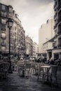 Toned monochrome image of a street cafe in Paris