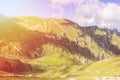 Toned panoramic view over the Carpatian mountains, green valleys Royalty Free Stock Photo