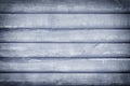 Toned photo of a fence made of wooden boards. Dark blue background with vignette, for layouts and sites Royalty Free Stock Photo