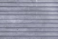 Toned photo of a fence made of wooden boards. Dark gray background for layouts and sites Royalty Free Stock Photo