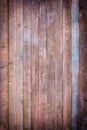 Toned photo of an old fence made of nailed boards. Dark brown background for sites and layouts with vignette Royalty Free Stock Photo