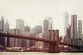 Toned photo of skyscrapers of Manhattan and Brooklyn bridge at winter day. Postcard view of New York Royalty Free Stock Photo