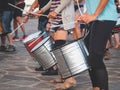 Toned photo of street musicians playing on drums on city street while celebrating carnival Royalty Free Stock Photo