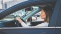 Toned portrait of beautiful female driver driving a car in city Royalty Free Stock Photo