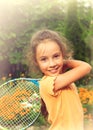 Toned portrait of cute little girl playing tennis outdoors Royalty Free Stock Photo