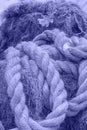 Toned with Very Peri color Rough Cord made from natural plant fiber. Rope detail, closeup. Vertical. Copy space Royalty Free Stock Photo