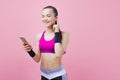 Toned young brunet woman stand checking mail on smartphone, have break from training, fit athlete sportswear . Royalty Free Stock Photo