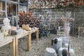 Old household utensils at the flea market. Empty bottles, pots, watering cans