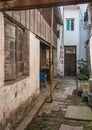 Narrow alley leading to door in Hutong dowtown Tongli, China