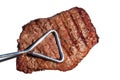 Tongs Holding Grilled Beef Loin Top Sirloin Steak