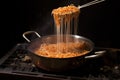 tongs lifting spaghetti from boiling water