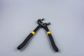 Tongue-and-groove slip-joint pliers detail with movable jaw on a white background
