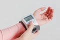 Tonometer device for measuring blood pressure on woman`s hand on