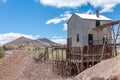 Building above pit surrounded by waste heaps, Historic Mining Park, Tonopah, NV, USA