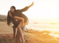 Tons of fun all summer long. two young women enjoying a piggyback ride at the beach. Royalty Free Stock Photo