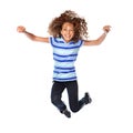 Tons of fun. Studio shot of a young girl jumping for joy against a white background. Royalty Free Stock Photo