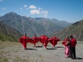Singer with dancers in mountains in Kyrgyzstan