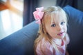 Too cute for words. High angle portrait of an adorable little girl sitting on the sofa at home. Royalty Free Stock Photo