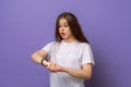 Too late, hurry up. Young beautiful brunette woman in hurry pointing finger on wrist watch, impatience, upset and angry for Royalty Free Stock Photo