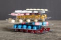 too many different pill cartridges stacked. selective Focus. Packs of blister pills with tablets. Colored pastilles Royalty Free Stock Photo