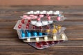 too many different pill cartridges stacked. selective Focus. Packs of blister pills with tablets. Colored pastilles Royalty Free Stock Photo