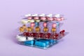 too many different pill cartridges stacked. selective Focus. Packs of blister pills with tablets. Colored pastilles Royalty Free Stock Photo
