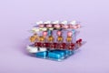 too many different pill cartridges stacked. selective Focus. Packs of blister pills with tablets. Colored pastilles Royalty Free Stock Photo