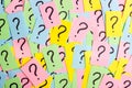 Too Many Questions. Pile of colorful paper notes with question marks. Closeup Royalty Free Stock Photo