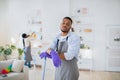 Too much domestic work. Tired black guy feeling bored of cleaning house with his girlfriend, free space