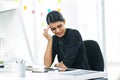 Too much stress on the job can seriously impact your life. a young businesswoman looking stressed out while working in Royalty Free Stock Photo