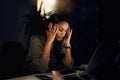 Too much stress on the job can seriously impact your life. a young businesswoman looking stressed out while working in Royalty Free Stock Photo