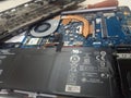 took apart the laptop for repair, added ram, and cleaned the fan and motherboard