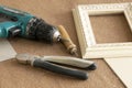 Tool Assembly frames, frames, for paintings, photographs, , screwdriver, wire cutters, pliers pencil on beige background