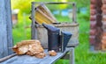 A tool of the beekeeper. Everything for a beekeeper to work with bees. Smoker, a number, a box Royalty Free Stock Photo