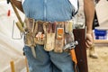 Tool belt on masonry construction worker wearing coveralls Royalty Free Stock Photo