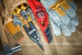 Tool belt with tooling construction level protective gloves on w Royalty Free Stock Photo