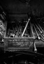 Tool bench in workshop with poorly organized tools.