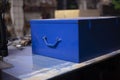 Tool box in blue. An old box lies on the table. Vintage object in the garage Royalty Free Stock Photo